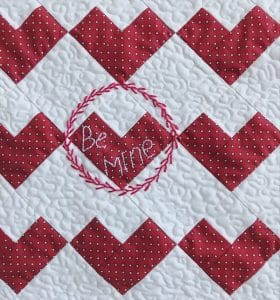 Close up red and white quilt