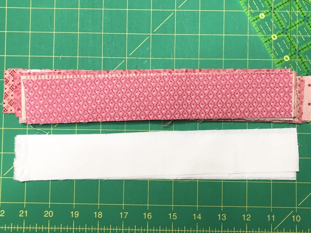 strips of pink and white fabric