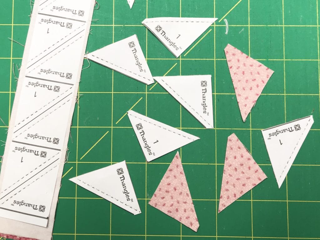 Close up of Thangles paper and cut fabric pieces