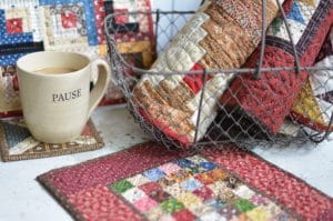 little quilts displayed on bench