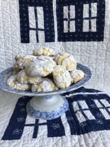 Blue and white house quilt with lemon crinkle cookies