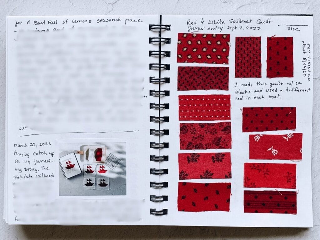 Inside of a quilt journal with red fabrics in it