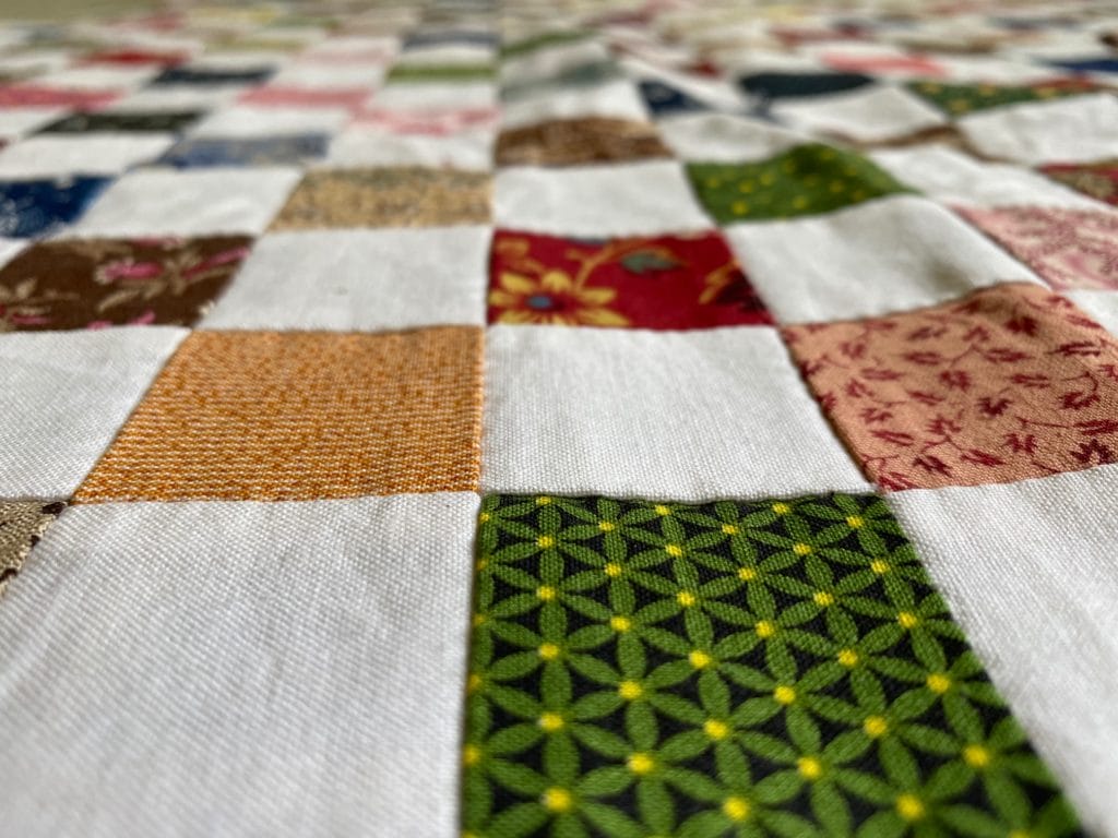Close up of postage stamp quilt project