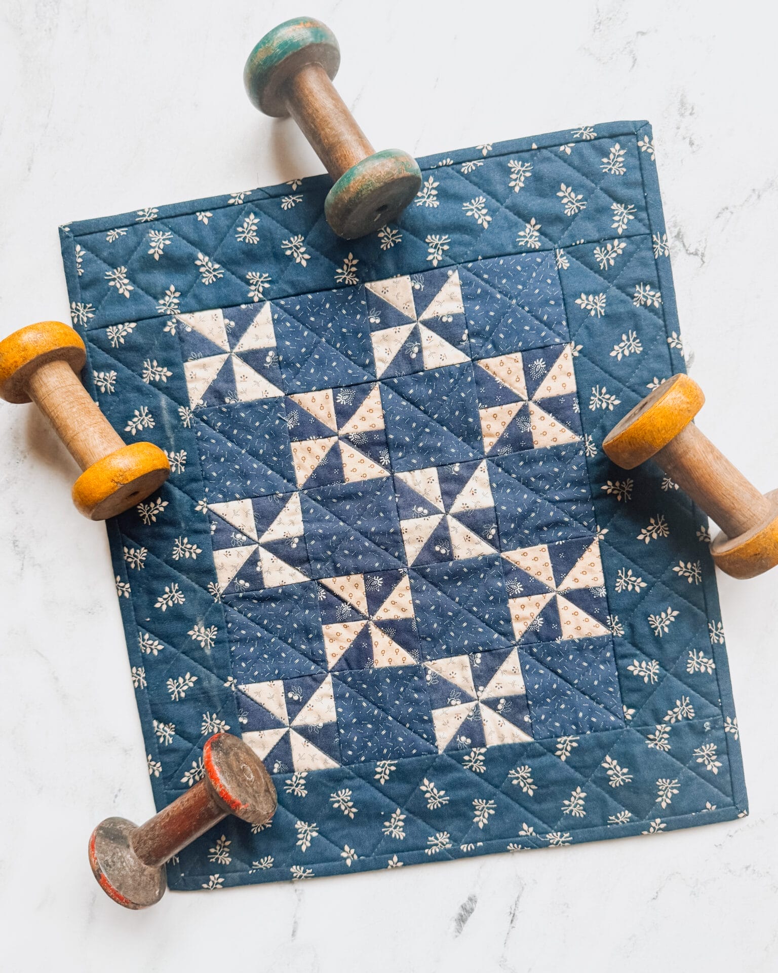 Small blue and white pinwheel quilt